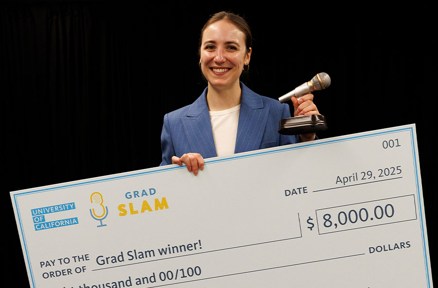 First place winner Sophia Miliotis holds her giant winner's check and the Slammy award